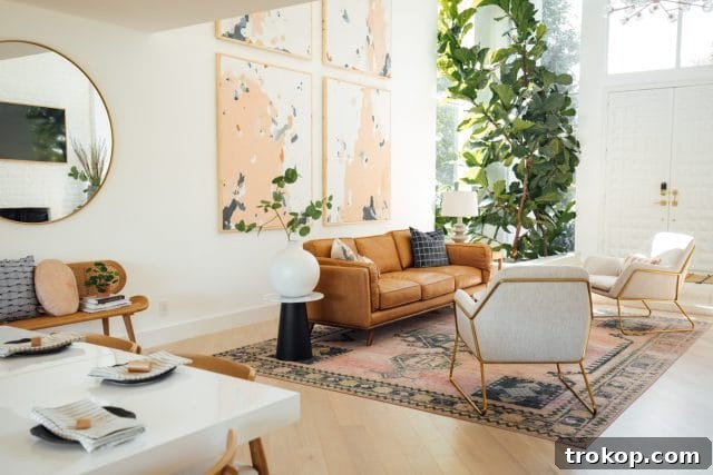 Revitalized Open-Plan Living and Dining Space 16 Dining room decor with a round gold mirror and rattan bench, enhancing the space's aesthetic appeal.
