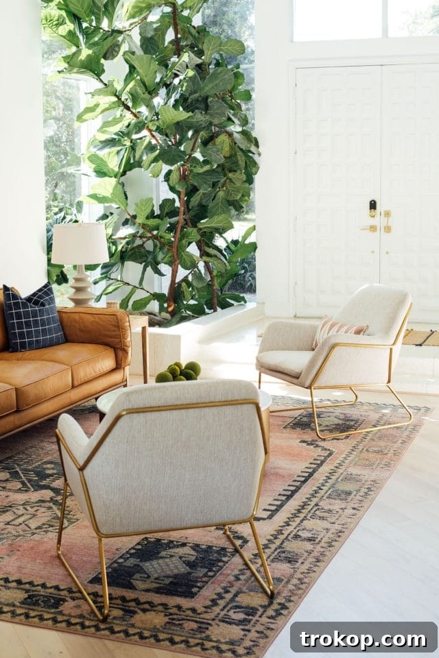 Revitalized Open-Plan Living and Dining Space 17 A large faux fiddle fig tree adds a touch of greenery to the living room.