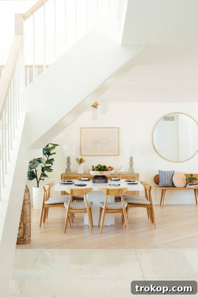 Revitalized Open-Plan Living and Dining Space 3 Open concept living room with a comfortable Timber sofa and woven Forma chairs.