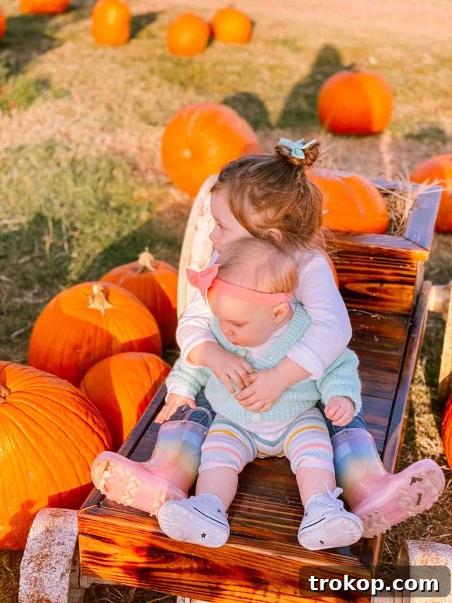 Luca and Gwen sharing a sweet hug at the pumpkin patch