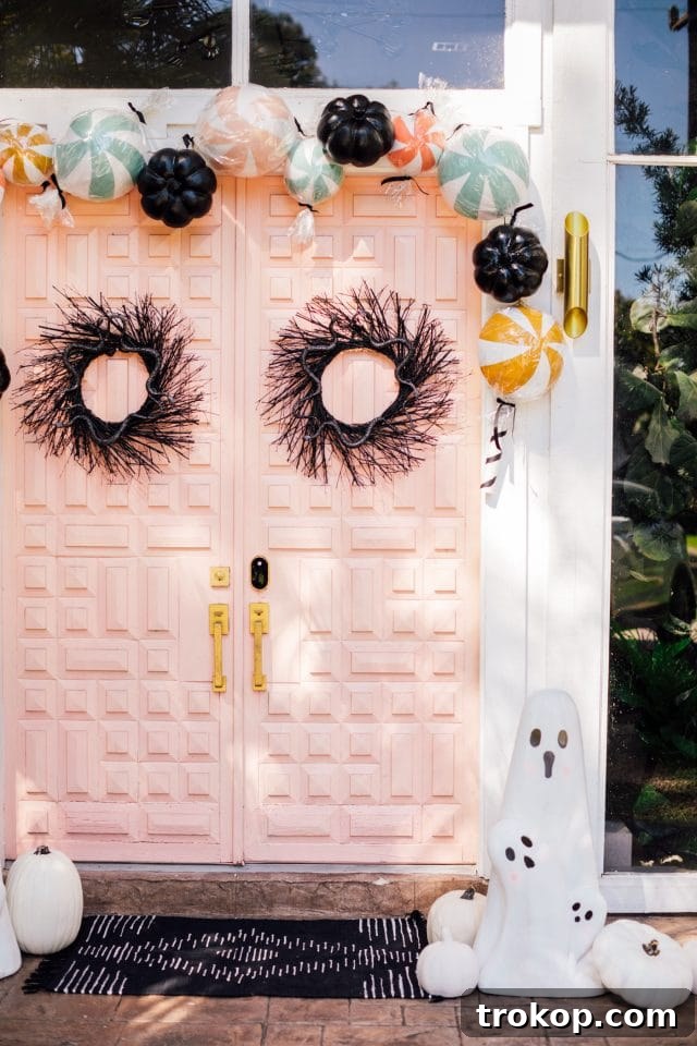 Boo-tiful Door Decor Cute Halloween Candy and Ghosts 11 pink front door with two black wreath and ghost