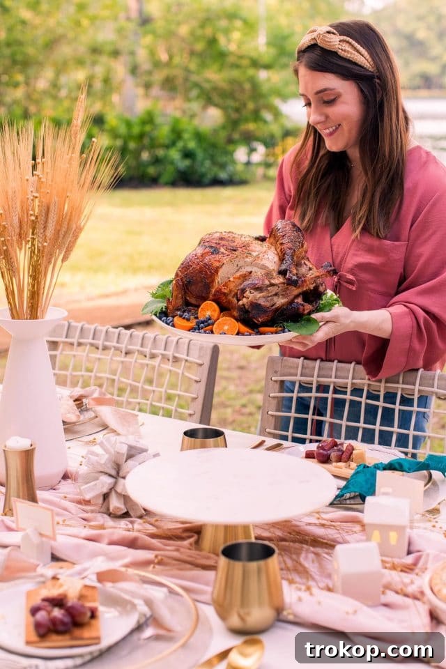 A perfectly cooked air fryer turkey, golden brown and ready for carving, surrounded by festive Thanksgiving decor.