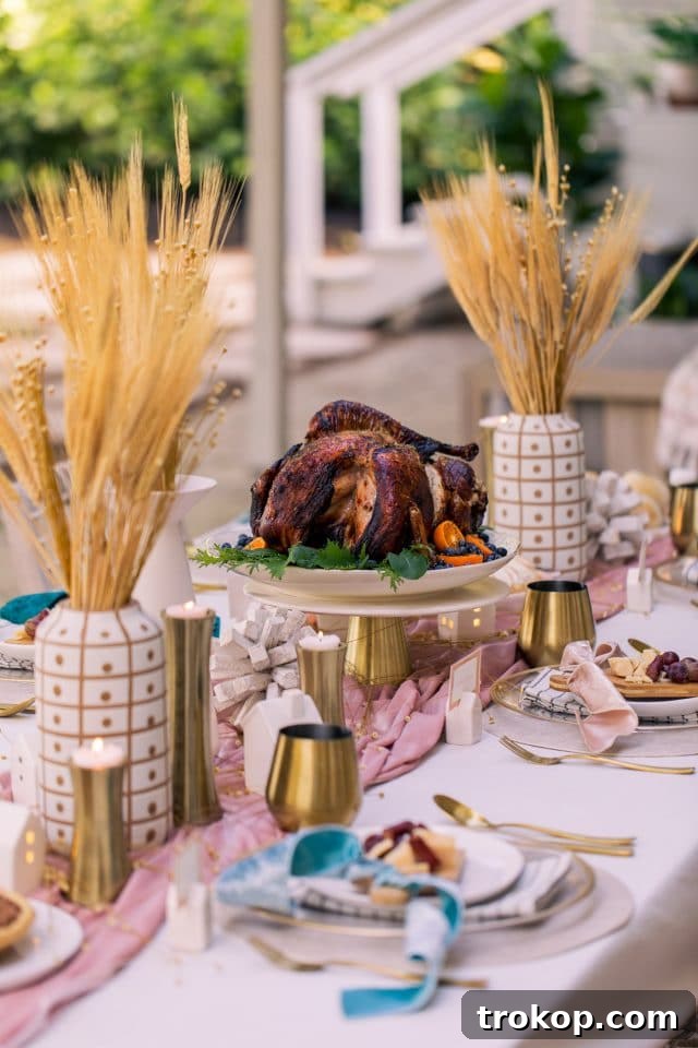 A beautifully decorated Thanksgiving table with the perfectly cooked air fryer turkey as the focal point, surrounded by side dishes.