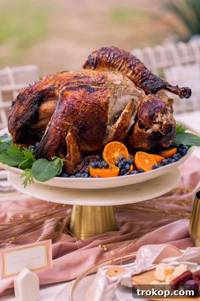 A side shot of the prepared Thanksgiving turkey, highlighting its golden skin and juicy appearance, ready to be served.