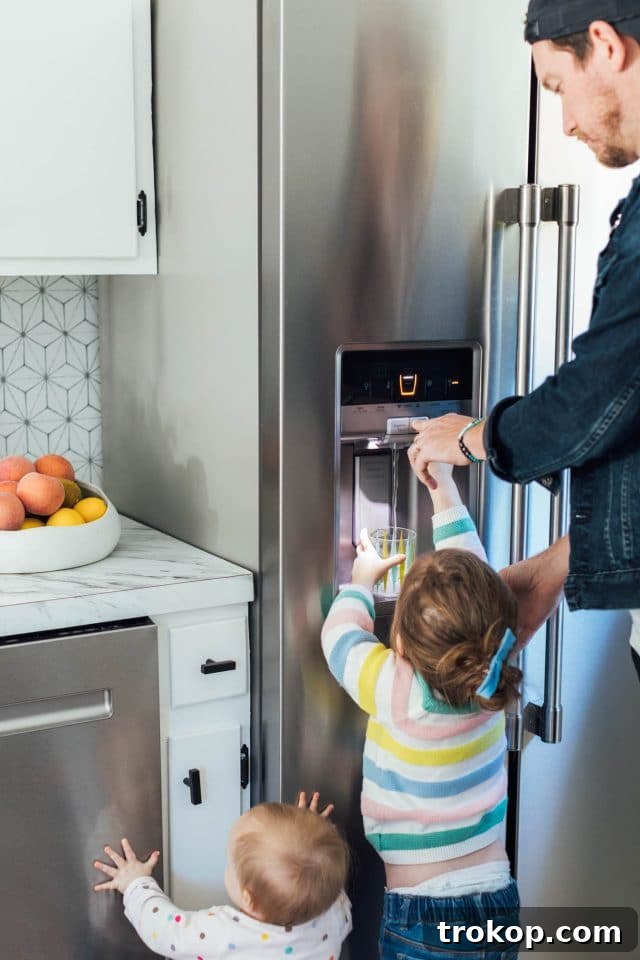 DIY Backsplash Using Adhesive Floor Tiles