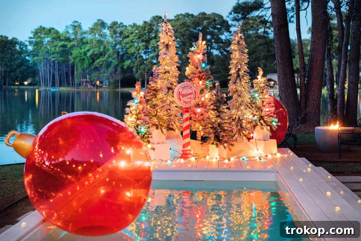 Santa's Poolside Paradise Christmas 13 A cozy outdoor seating area next to a beautifully illuminated Christmas pool deck, complete with a roaring fire pit, creating a perfect winter evening ambiance.