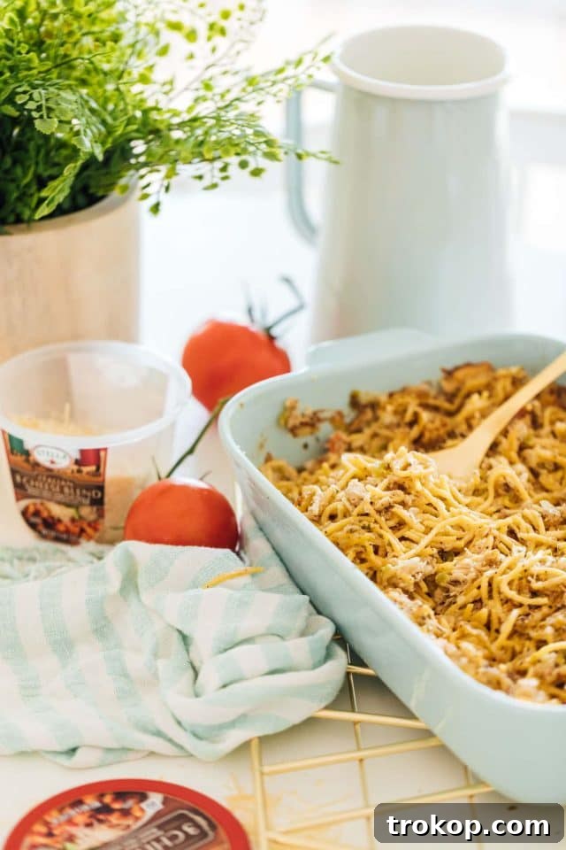 Photo of an easy chicken pasta bake recipe by top Houston lifestyle blogger Ashley Rose of Sugar & Cloth