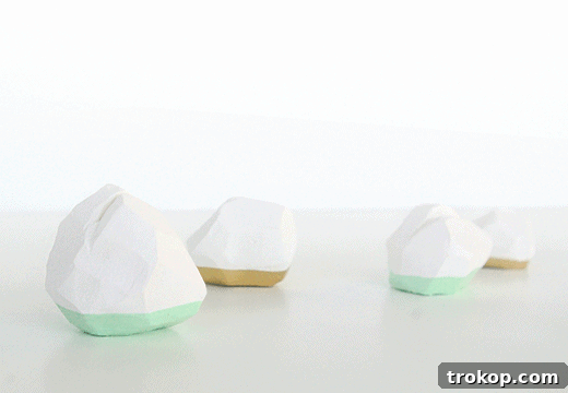 Collection of finished DIY geometric place card holders in mint and gold