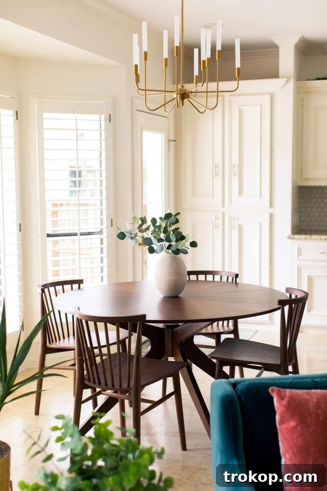 Angled view of a contemporary dining area with an Article dining table and chairs.
