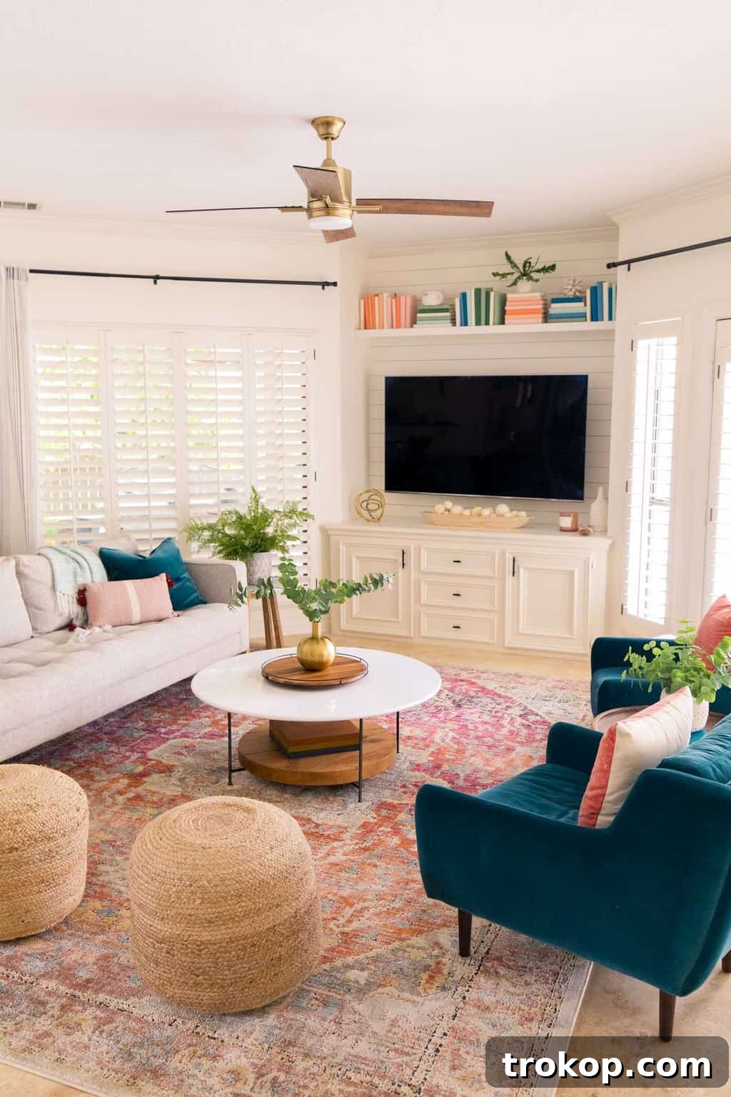 Stylish family room with a focal point TV, elegant coffee table, and comfortable seating.