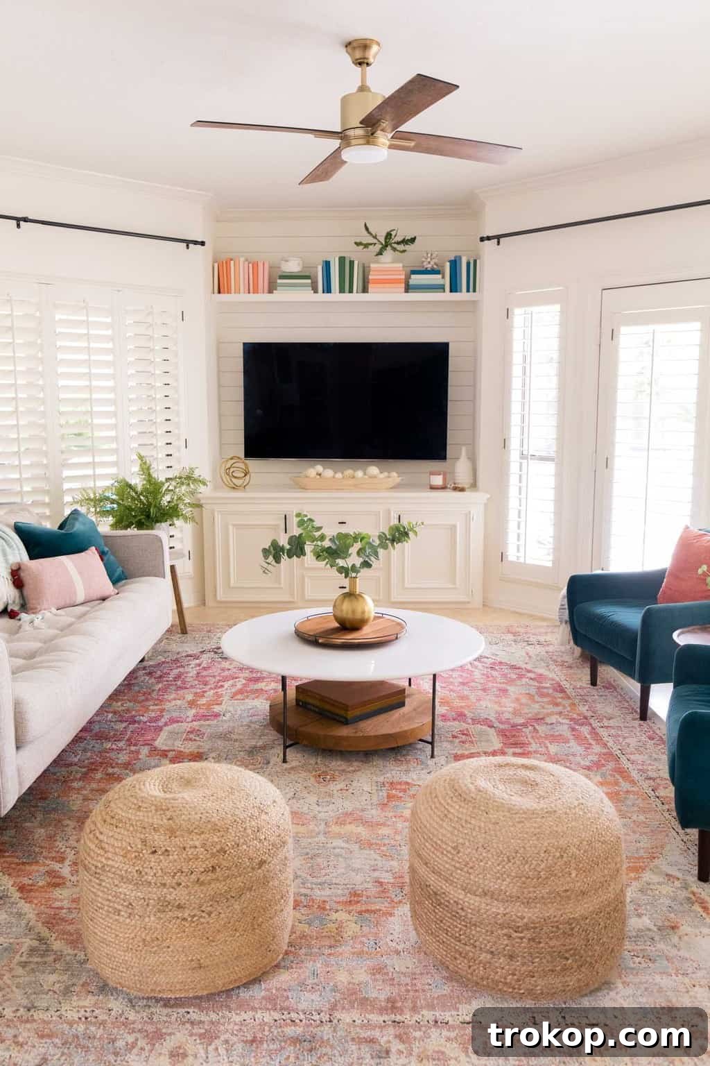 Front view of the stunning family room makeover, centered around the TV and modern decor.