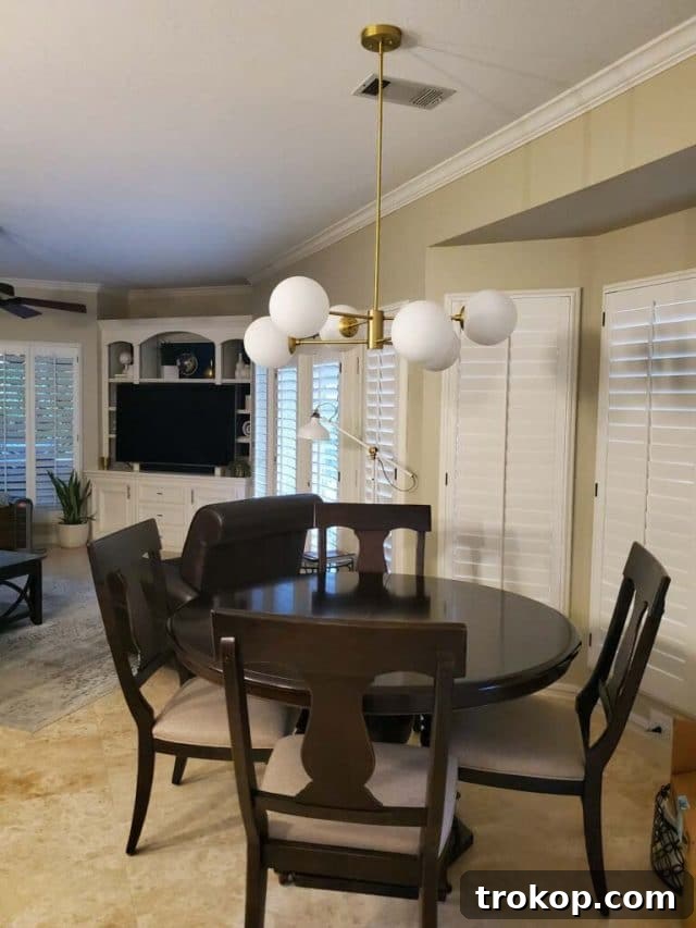 Dining area before makeover, showing dark decor and lack of modern appeal.