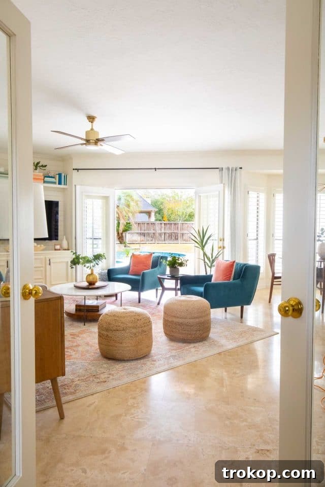 Inviting view into the newly renovated family room, highlighting the bright color scheme and open layout.