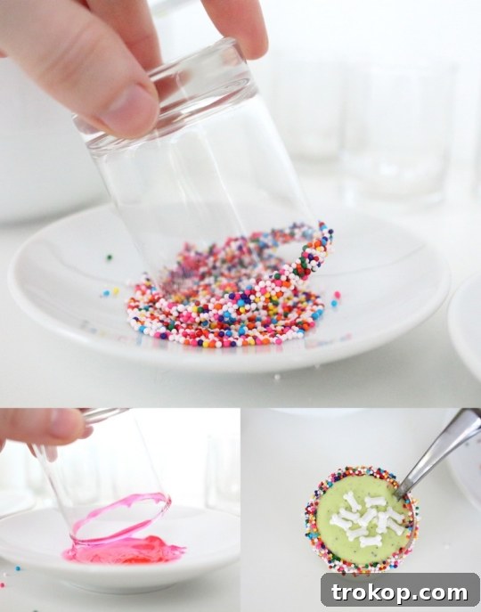 Assortment of ingredients for Monster Guts recipe including Cool Whip, Oreos, gummy worms, and sprinkles.
