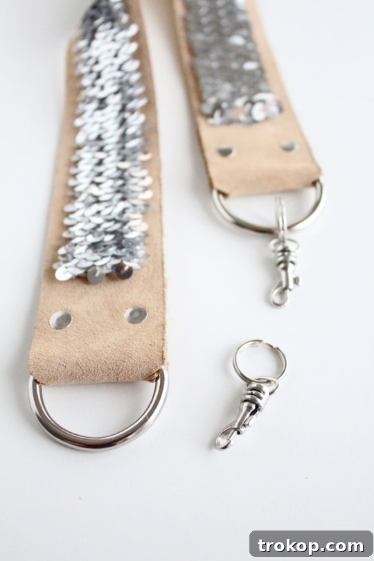 Installing double-cap rivets to reinforce D-rings on a camera strap