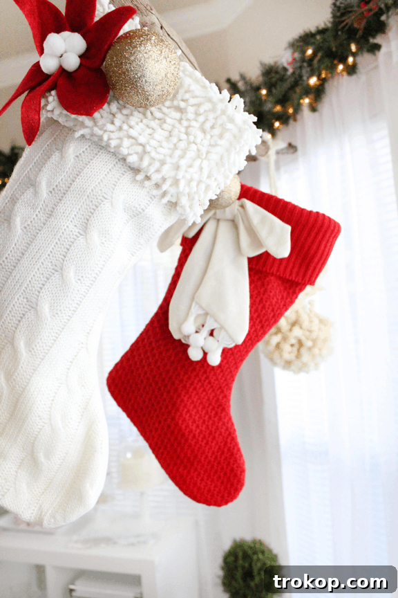 Detailed view of Christmas decorations including mushroom ornaments and a pre-lit berry garland from Martha Stewart Living, creating a festive ambiance.