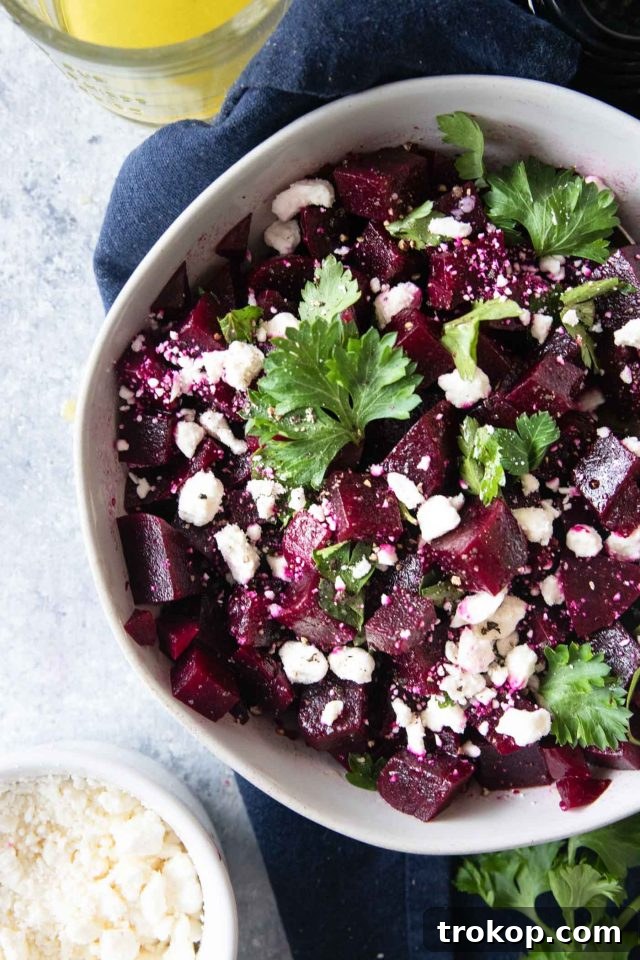 Vibrant Beetroot and Goat Cheese Salad 6 A beautifully presented beet salad with crumbled goat cheese, fresh parsley, and a lemon vinaigrette, ready to be served.