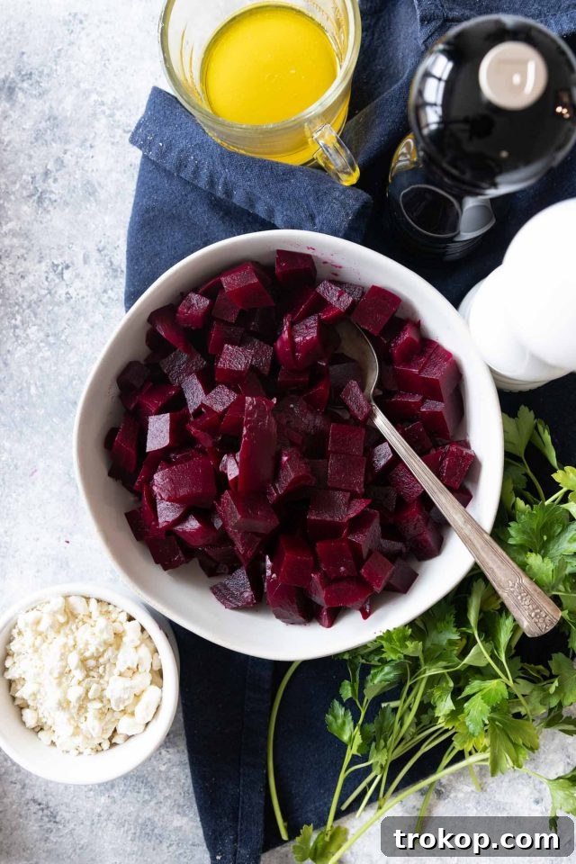 Vibrant Beetroot and Goat Cheese Salad 8 Overhead photo of an easy beetroot salad recipe ingredients laid out, with some beets already cubed, signaling readiness for assembly.