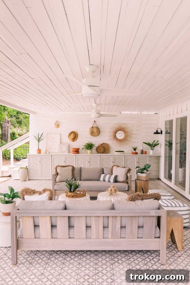 Vertical photo of outdoor Article sofas on the beautifully tiled outdoor patio