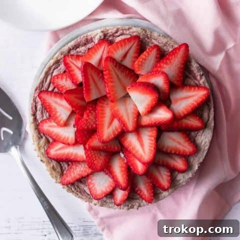 A delicious low-carb keto strawberry cheesecake, perfectly baked and chilled, promising a delightful dessert experience.