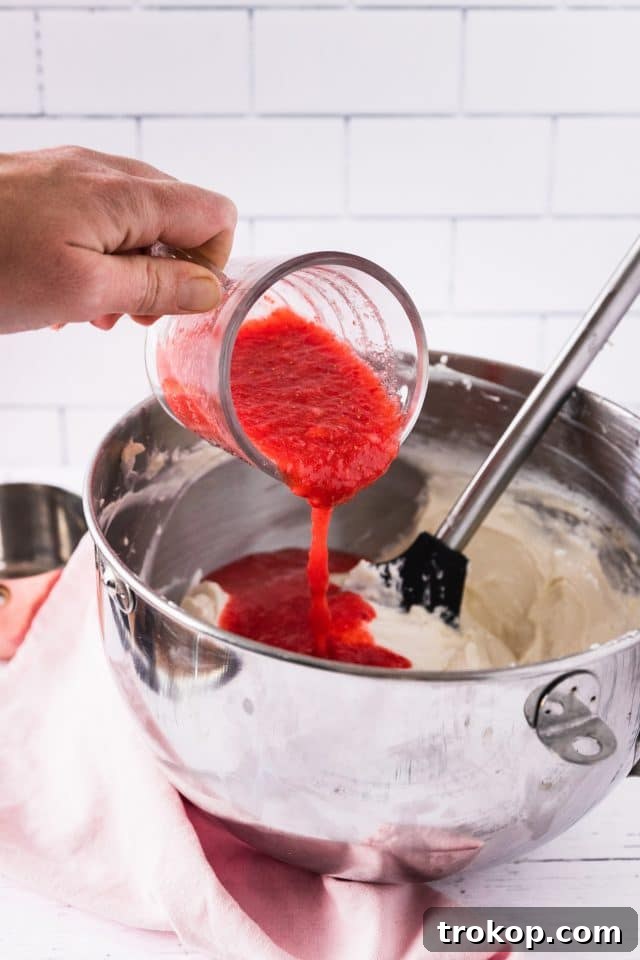 A step-by-step photo illustrating how to prepare the crust for a keto strawberry cheesecake, showing the ingredients being mixed together.