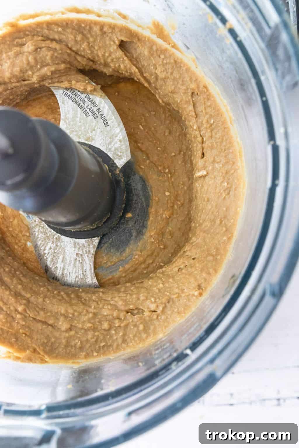 Grind Chickpeas, nut butter, sweetener, salt, baking powder, and oats, and vanilla extract in the bowl of a food processor for the Chickpea Cookie Dough