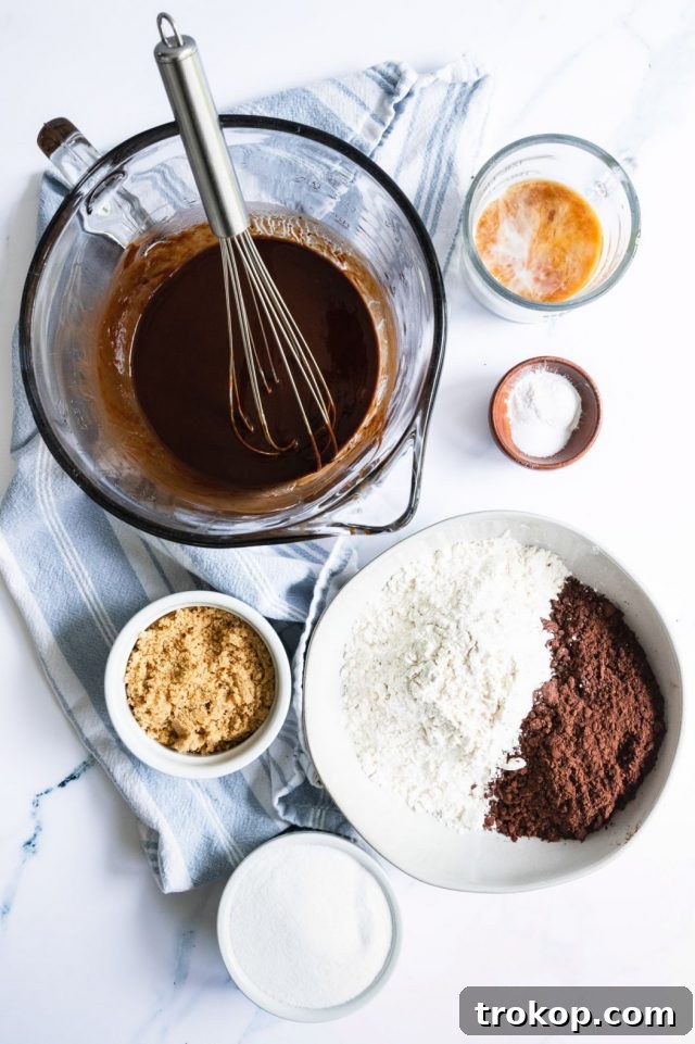A photo of the chocolate and butter melting in a double boiler for Vegan Egg Free Brownies by Sugar and Cloth