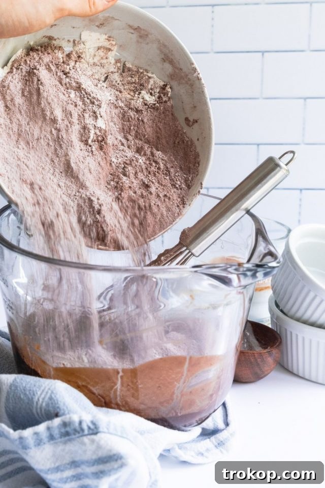 A photo of melted chocolate and butter in a bowl for Vegan Egg Free Brownies by Sugar and Cloth