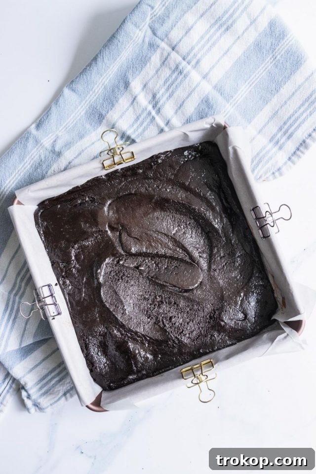 A photo of how to make Vegan Egg Free Brownies, showing the baked brownies, by Sugar and Cloth