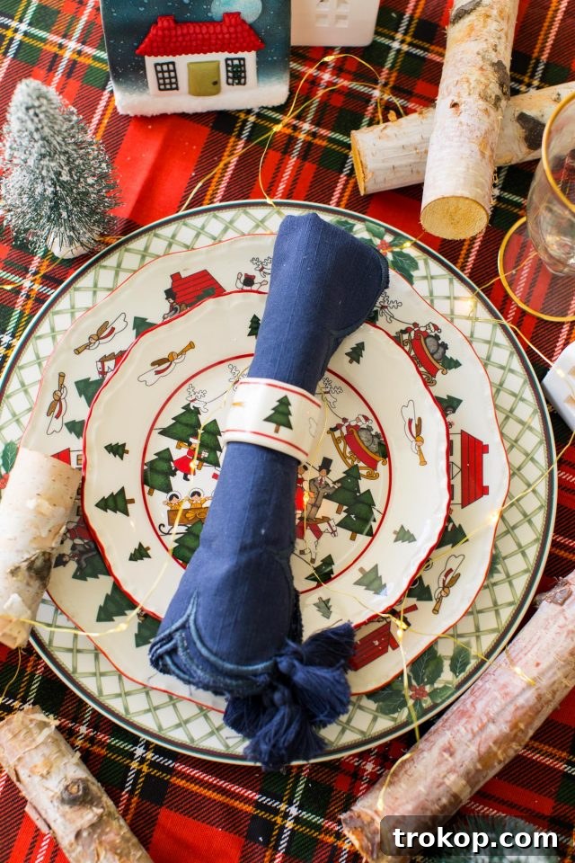 A traditional Christmas plate setting, beautifully capturing the essence of a classic Christmas aesthetic, by Ashley Rose of Sugar & Cloth
