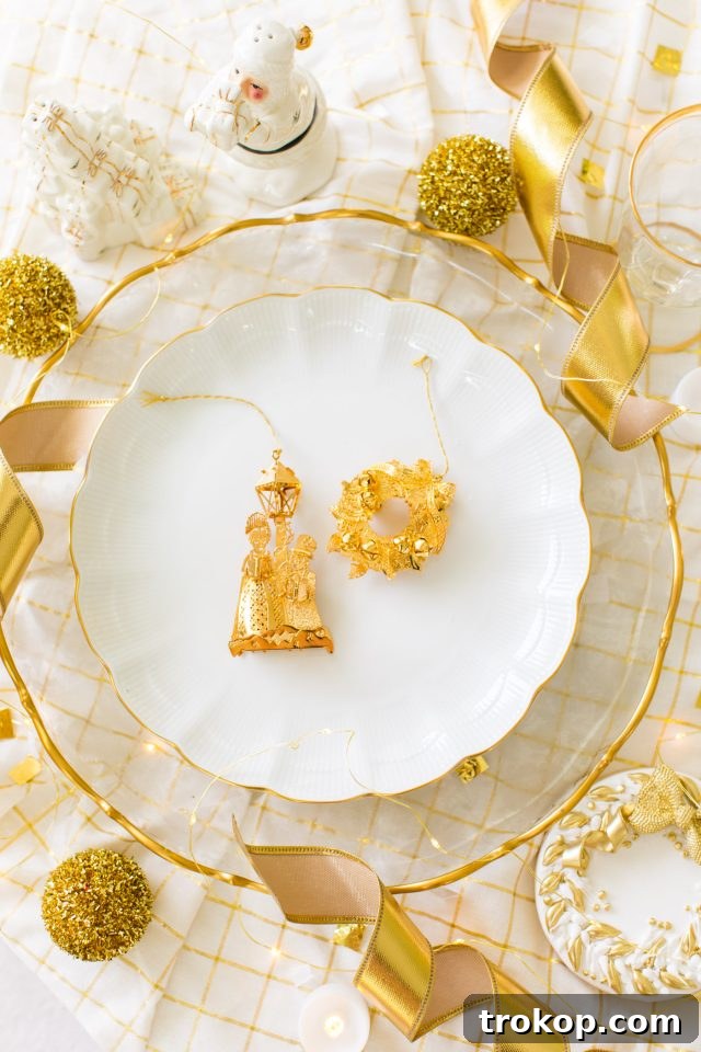 A classic gold and white Christmas aesthetic featuring exquisite gold Christmas table decor