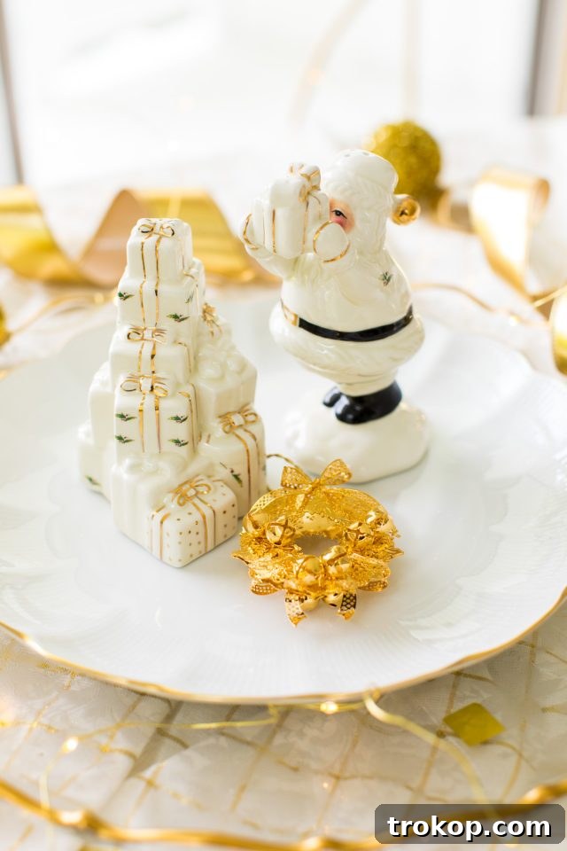 Charming Santa salt and pepper shakers, key elements of a classic gold and white Christmas aesthetic