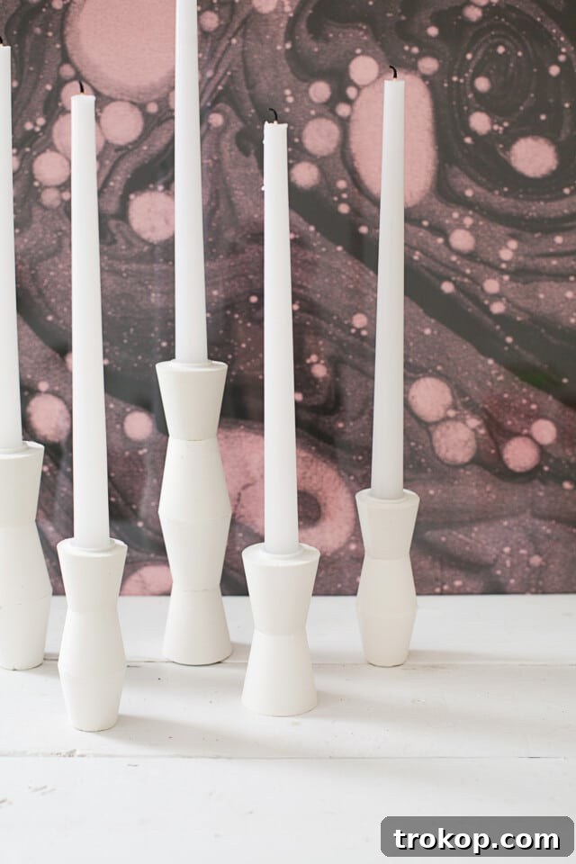 Craft Your Ambiance: 21 DIY Candle Holder Designs for a Colorful Fragrant Home 17 DIY Mid Century Candlestick Holders by A Beautiful Mess