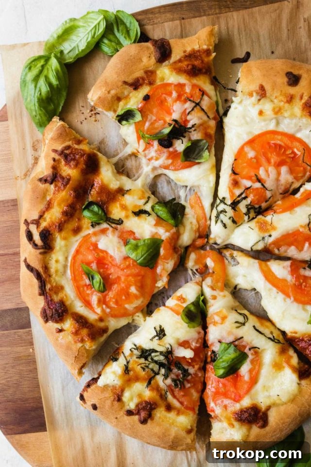 Creamy White Sauce Pizza 11 Freshly baked white pizza sliced into 8 pieces, ready for serving