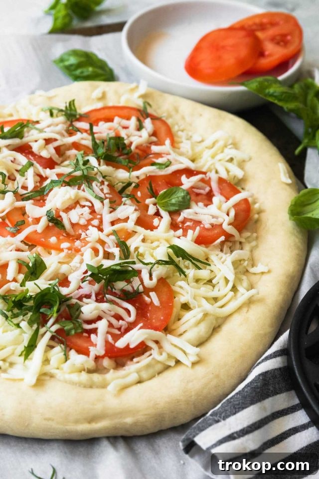 Creamy White Sauce Pizza 9 Unbaked white pizza with cheese and various toppings