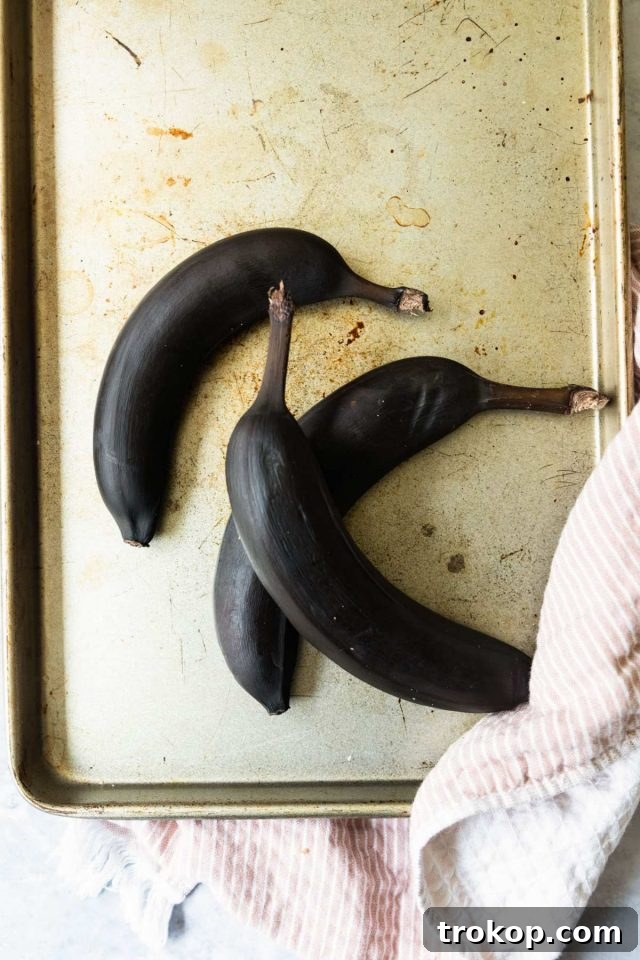 A freshly baked slice of banana bread with walnuts, ready to eat.