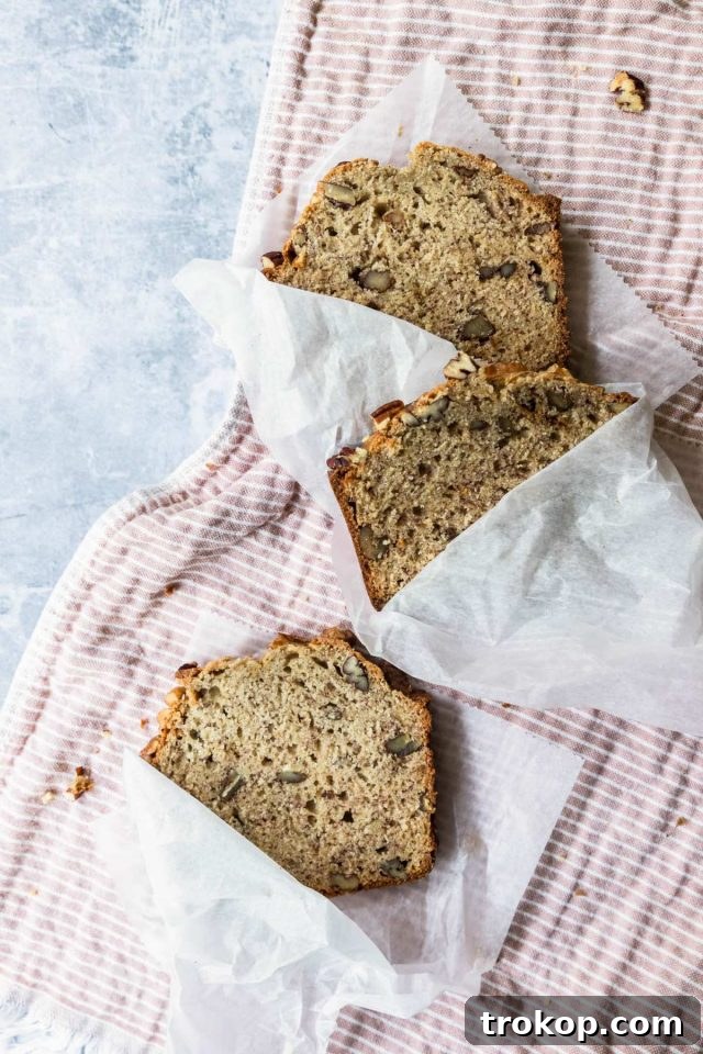 Freshly baked banana bread loaf cooling on a wire rack.