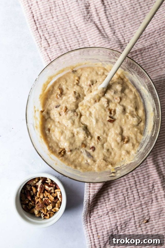 Finished banana bread batter in a bowl, ready for the pan.