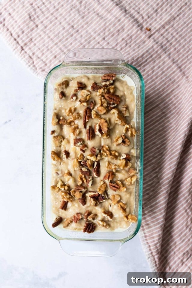 Close-up of the banana bread batter in the loaf pan before baking.
