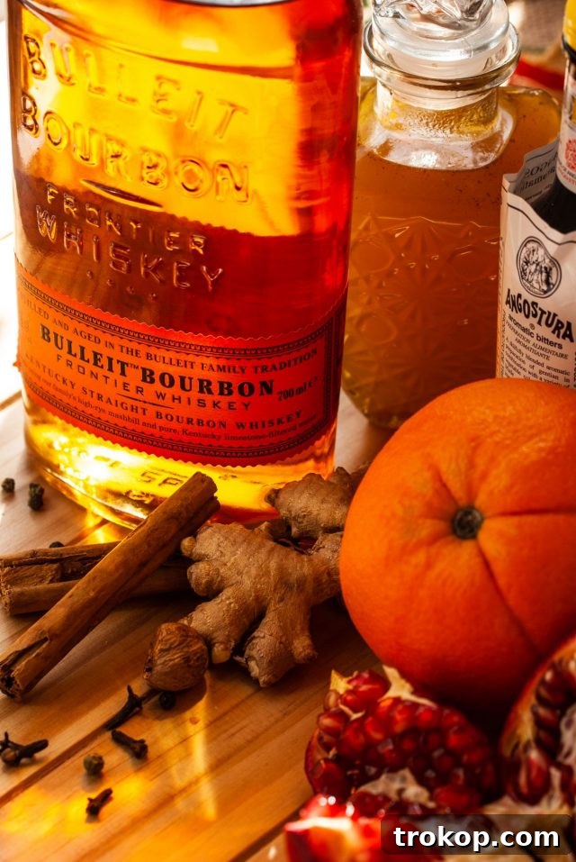 Heirloom Christmas Recipes 4 Ingredients for the Christmas Old Fashioned cocktail, including bourbon, gingerbread syrup, and bitters.