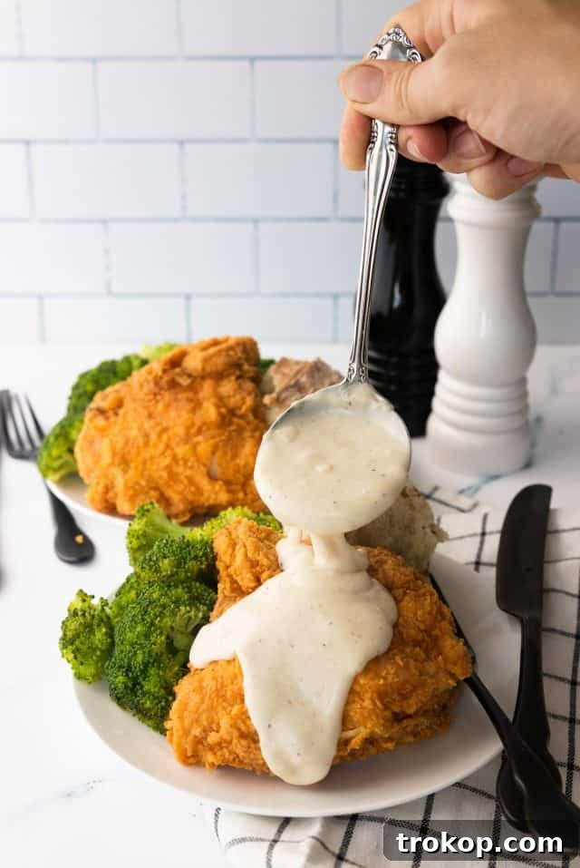 Homestyle White Country Gravy 2 Country Gravy Recipe - photo of the white country gravy served with fried chicken