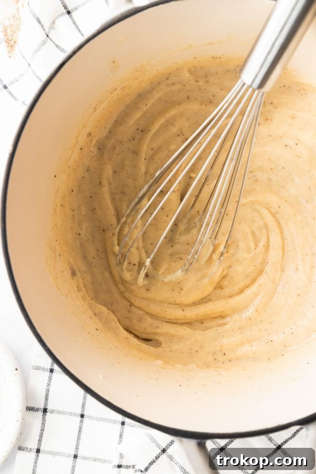 Homestyle White Country Gravy 6 Country Gravy Recipe - photo of the gravy being whisked