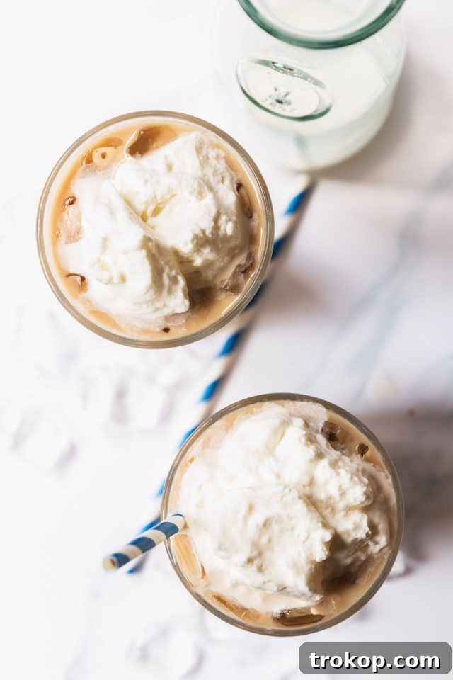 Two servings of Iced White Chocolate Mocha with whipped cream on top