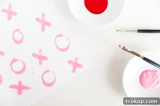 Handmade Hugs and Kisses Gift Wrap 3 DIY xoxo gift wrap being painted
