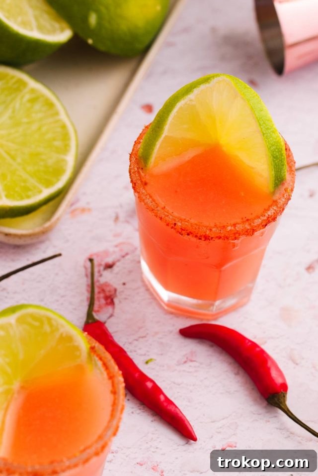 A Mexican candy shot garnished with a chili pepper, ready to be enjoyed.