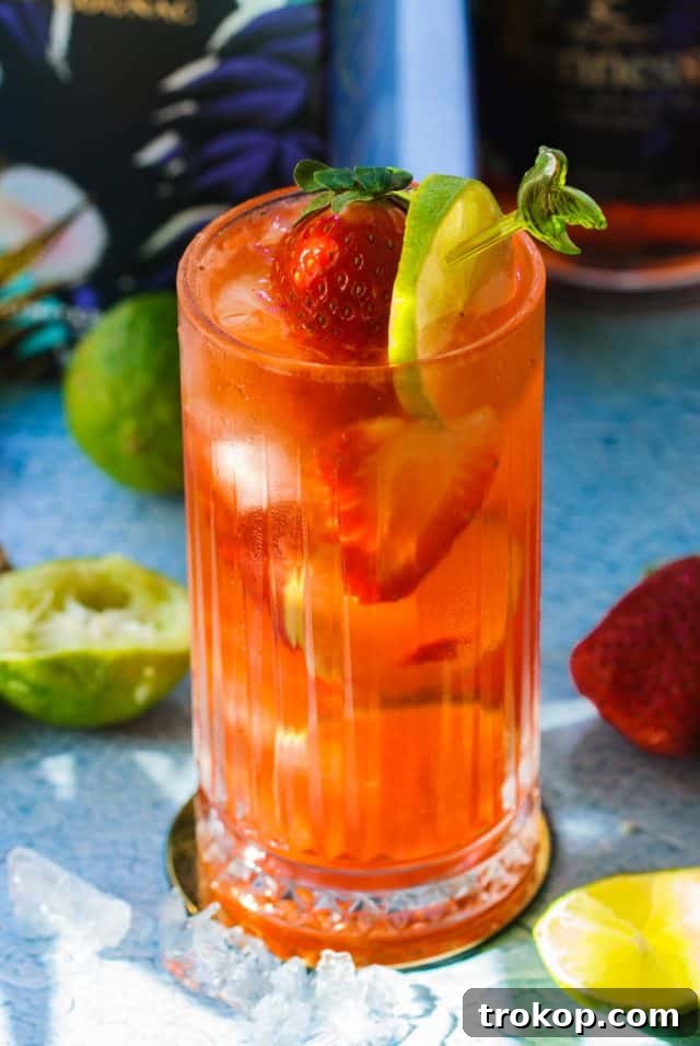 a glass of strawberry hennessy drink
