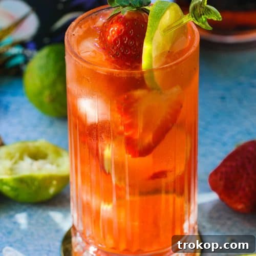 a glass of strawberry hennessy drink