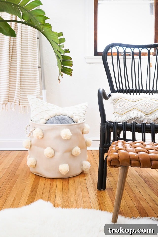 25 Dreamy Bedroom Ideas Little Girls Will Adore 4 DIY Fluffy Pom Pom Bin by top Houston lifestyle Blogger Ashley Rose of Sugar & Cloth