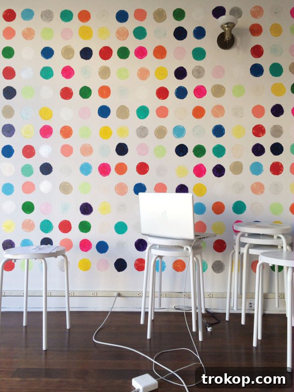 Whimsical polka dot wall painted with sweet potato stamps for unique texture