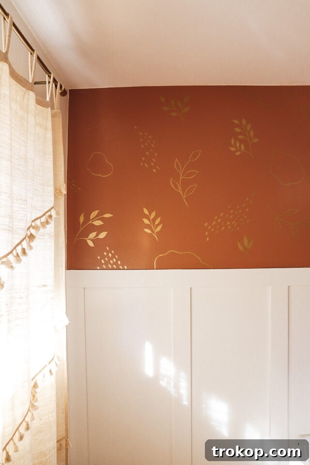 Elegant gold leaves painted on a wall for a luxurious natural theme